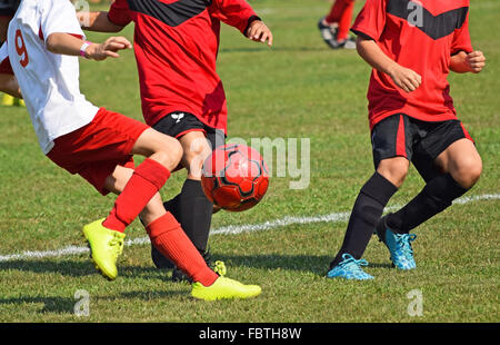 Young soccer players in action Stock Photo