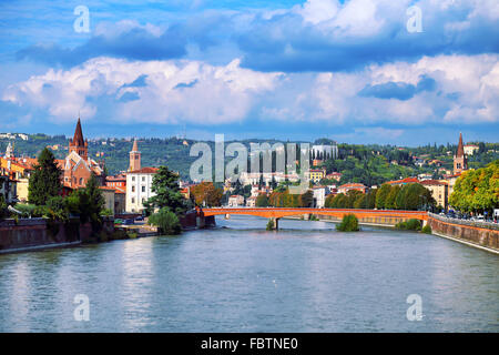 Bridge over river in Verona against cloudy sky Stock Photo