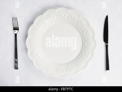 Place setting with plate, knife and fork Stock Photo