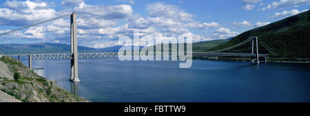 Bridge over wide river Stock Photo