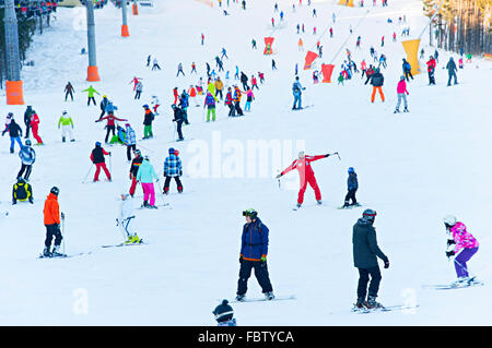 Lots of people on a mountain slope at ski resort in Bukovel. Stock Photo