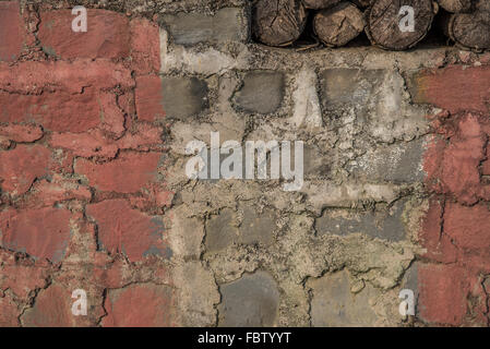 Close-up detail red and white roughly painted wall. INDIA Stock Photo