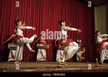 A group of Kandyan dancers performing the Pooja dance with the Kandyan drummers part of the Kandyan dance in Kandy, Sri Lanka Stock Photo