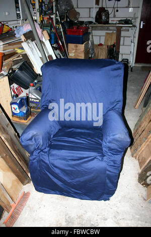 Blue chair in a garage. Stock Photo