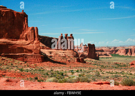 The Three Gossips is a red rock formation sculpted from Entrada Sandstone over millions of years. Stock Photo