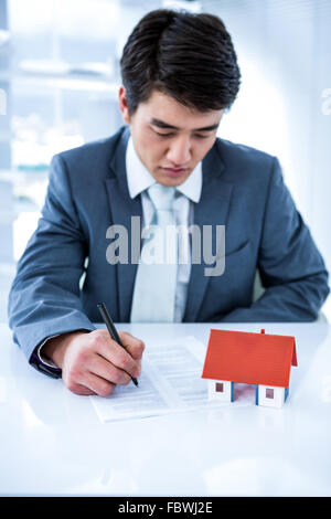 Asian businessman read a estate contract Stock Photo