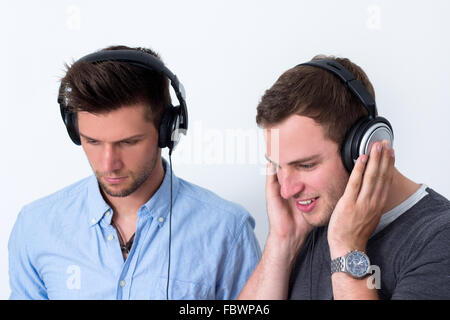 Two friends listening to music Stock Photo