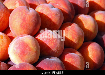 Peaches on a heap Stock Photo