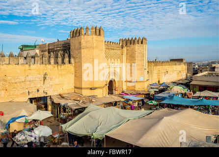 Market in Bab Chorfa at sunset, view from Bou Jeloud square. Bab Chorfa is a gate to ancient Fez El Bali Medina. Fez, Morocco. Stock Photo