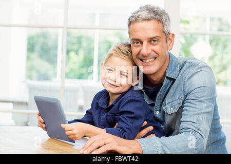 Father and son using tablet Stock Photo
