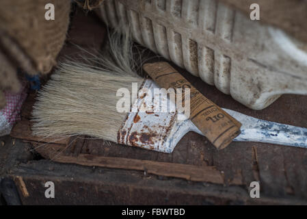 Still life.  Close-up of rusty paintbrush on wood.  Remote village of Thembang Dzong, INDIA Stock Photo