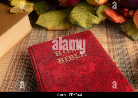 still life old holy bible with black stain on the cover, close up Stock Photo