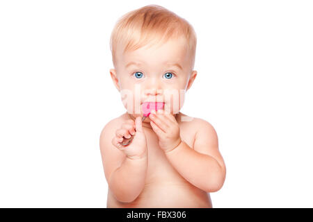 Cute baby with food spon in mouth Stock Photo