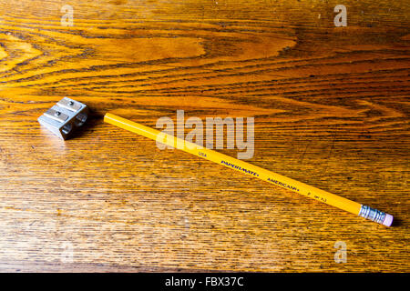 A yellow pencil and sharpener Stock Photo