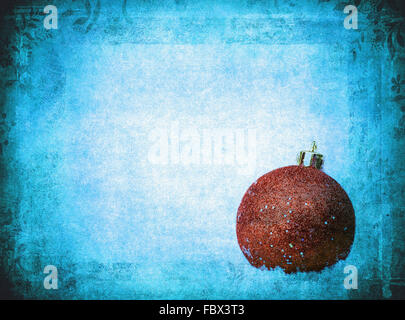 bauble over grunge texture, nice christmas background Stock Photo