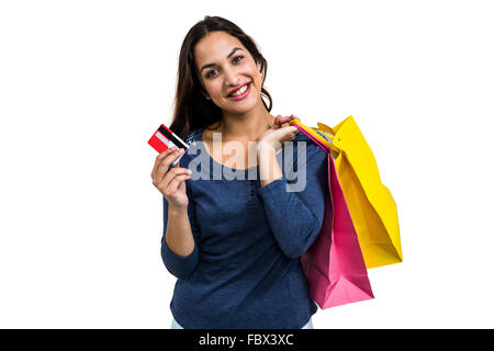 Portrait of happy young woman with shopping bags and payment card Stock Photo