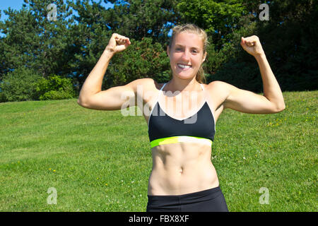 Pretty Athletic Woman Flexing Her Muscles Stock Photo 4366504