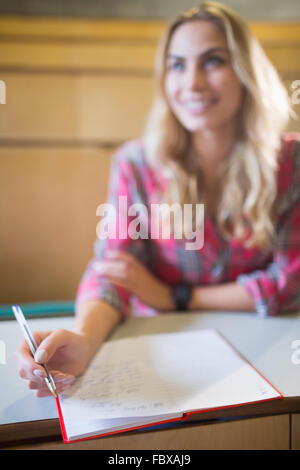 Smiling female student during class Stock Photo - Alamy