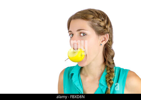 Girl taking a bite of an apple. Stock Photo