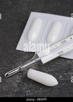 Suppository and Clinical Thermometer Stock Photo