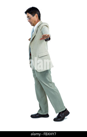 Focused businessman walking straight ahead Stock Photo