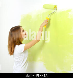 girl painting a wall Stock Photo