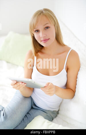 Young attractive girl with tablet pc Stock Photo