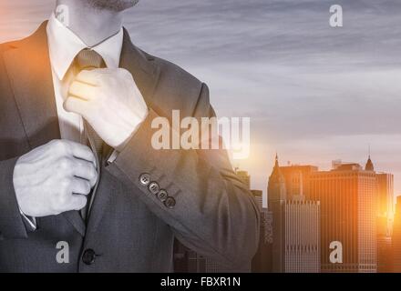 Preparing For Work Concept. Young Office Worker in Elegant Suit Making Last Preparation For Potentially Successful Day in His Of Stock Photo
