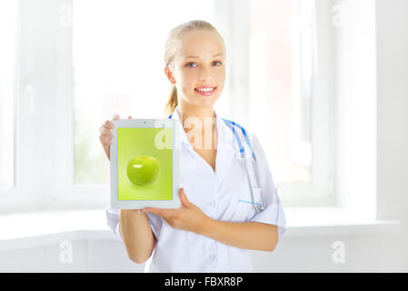 Female doctor with tablet pc Stock Photo