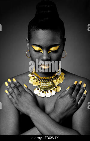African woman face with gold jewelry Stock Photo - Alamy