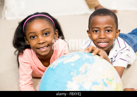 Close up of kids using a world globe Stock Photo