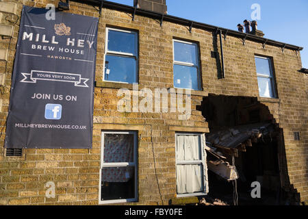 Flooding caused part of a wall of the Mill Hey pub in Haworth, England, to collapse. Stock Photo