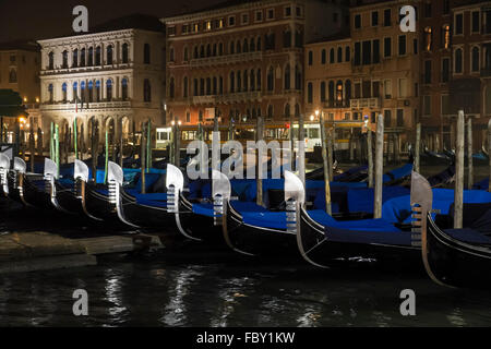 Gondolas moored along the Grand Canal in Venice Stock Photo