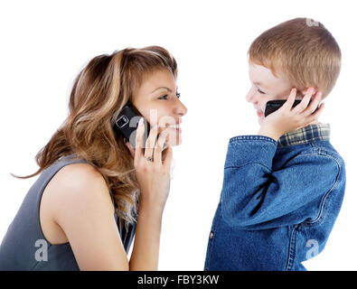 girl and  boy talk by a cellular telephone Stock Photo