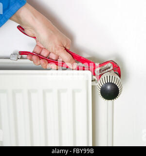 Plumber and radiator Stock Photo