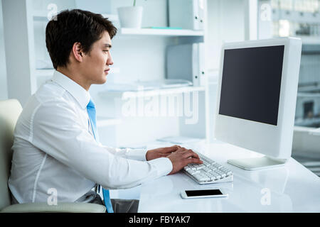 Asian businessman using his computer Stock Photo