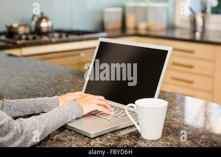 Close up of woman using laptop Stock Photo