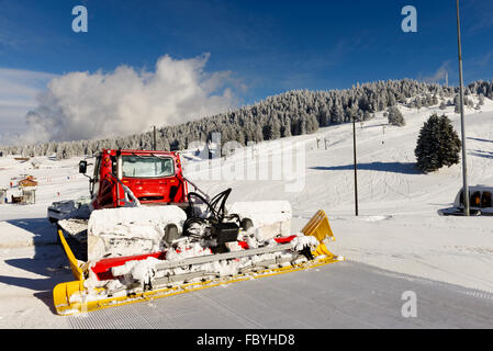 a snowcat, machine for snow removal, preparation ski trails Stock Photo