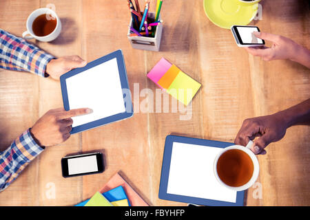Cropped image of business people using technologies Stock Photo