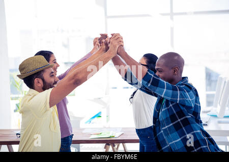 Cheerful Businessmen and businesswomen performing group activity Stock Photo