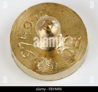 weight of five grams made from brass Stock Photo