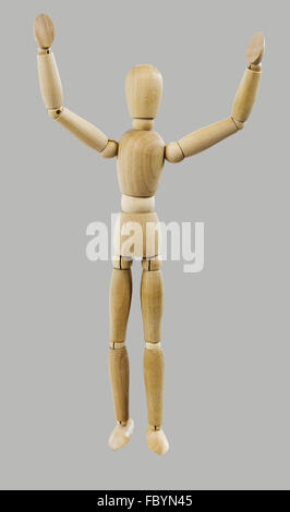 wooden Dutch doll with hands in the air Stock Photo
