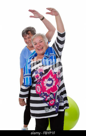 Two senior women doing gym exercises Stock Photo