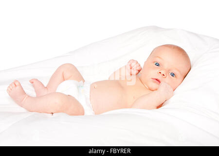 Cute baby infant laying on pillow Stock Photo