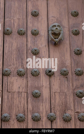 Heavy wooden door of Templo del Ex-Hospital de San Juan de Dios, a 17th century Roman Catholic Church in Puebla Mexico. Stock Photo