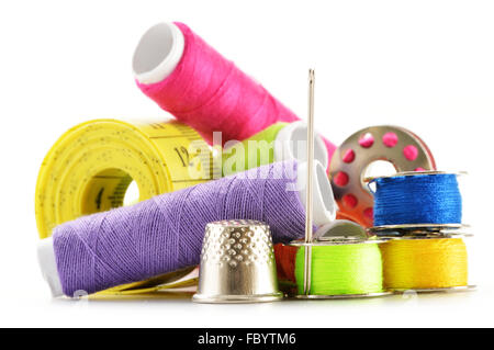 Composition with tailor needles and threads over white background Stock Photo