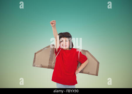 Composite image of boy pretending to be a pilot Stock Photo