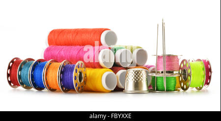 Tailor needles and threads over white background Stock Photo