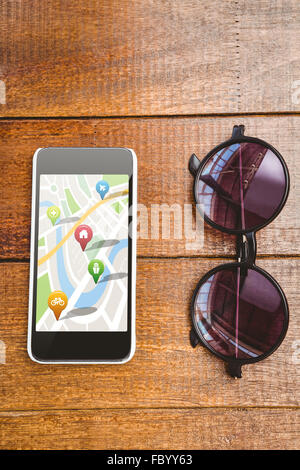Composite image of navigation pointers with various representations on map Stock Photo