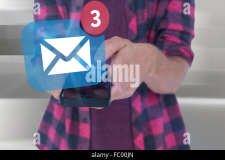 Composite image of midsection of man in casuals using smart phone Stock Photo